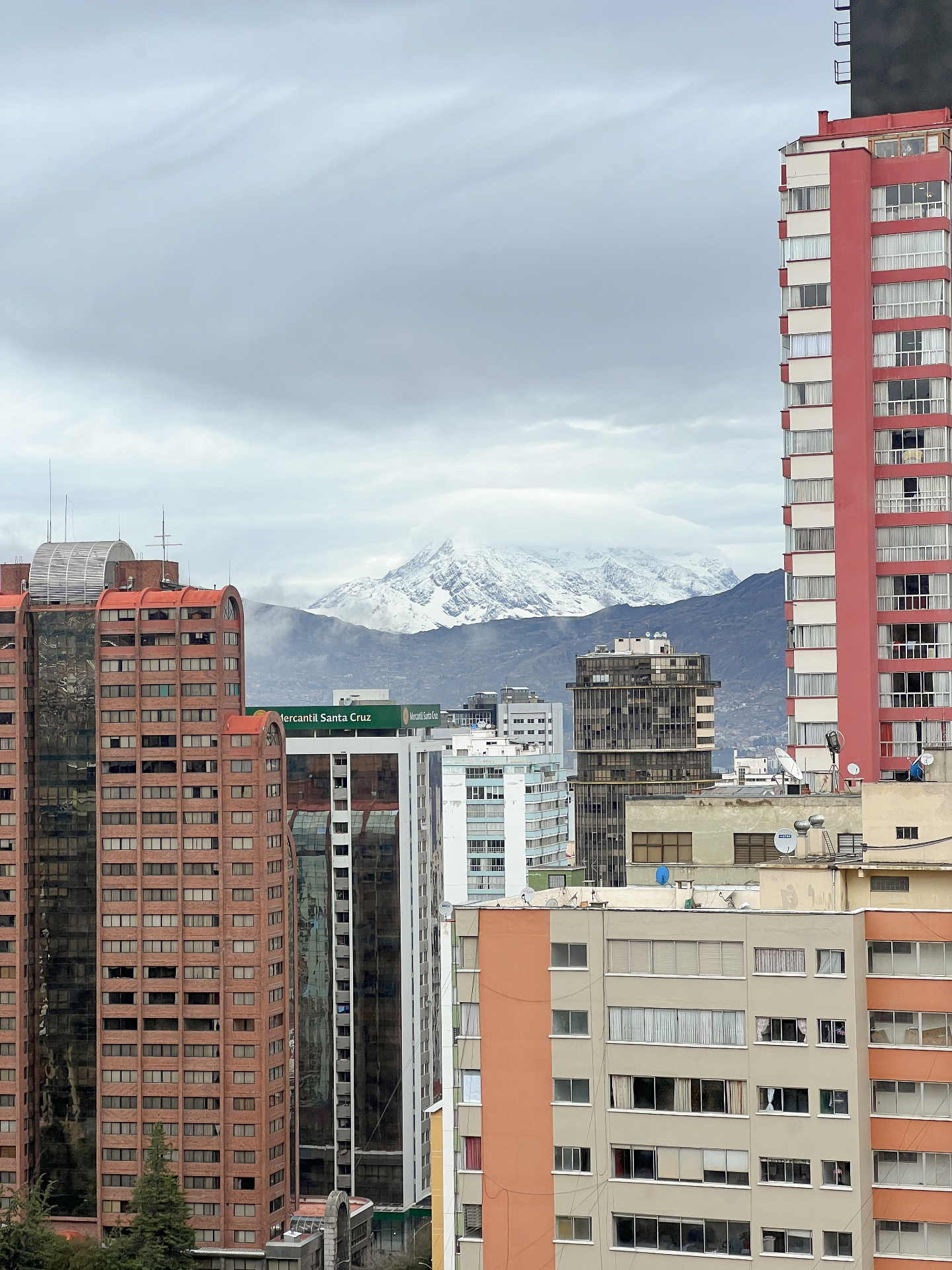 View across the rooftops of La Paz toward snow-covered Illimani