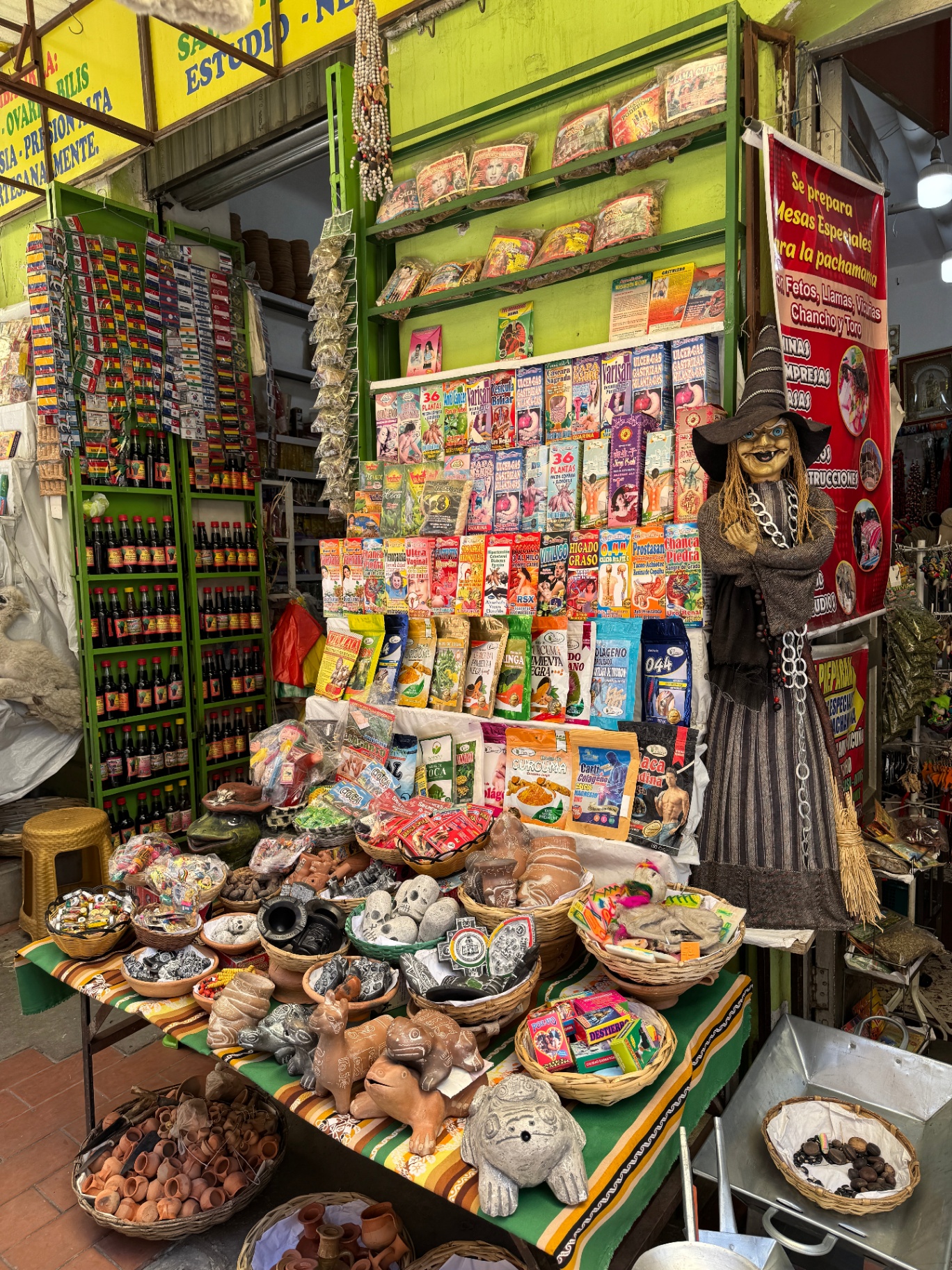 Witches' Market stall in La Paz filled with dried herbs, amulets, and ritual offerings