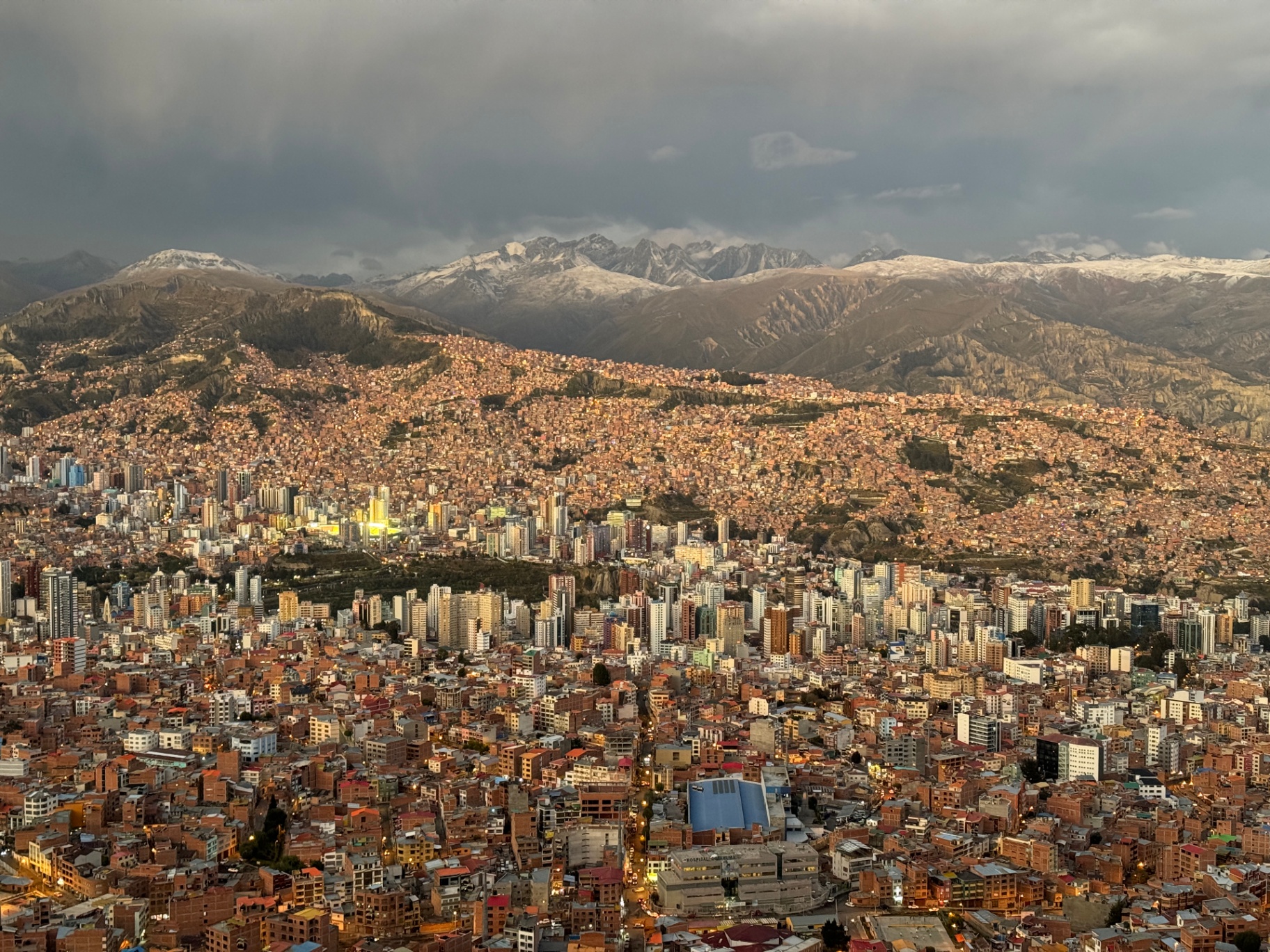 Panoramic view of La Paz at dusk with the snowcapped Andes on the horizon